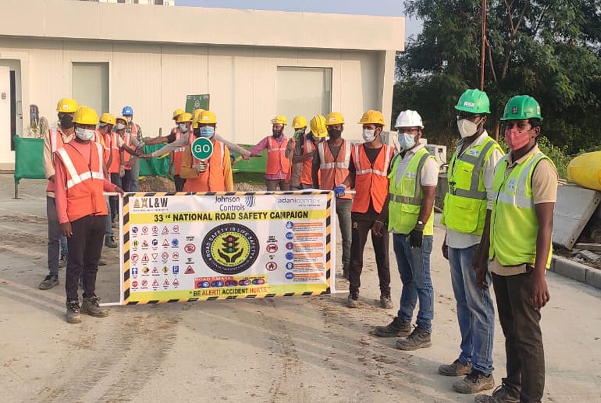 AdaniConneX Team members holding a banner while conducting a Road Safety Campaign