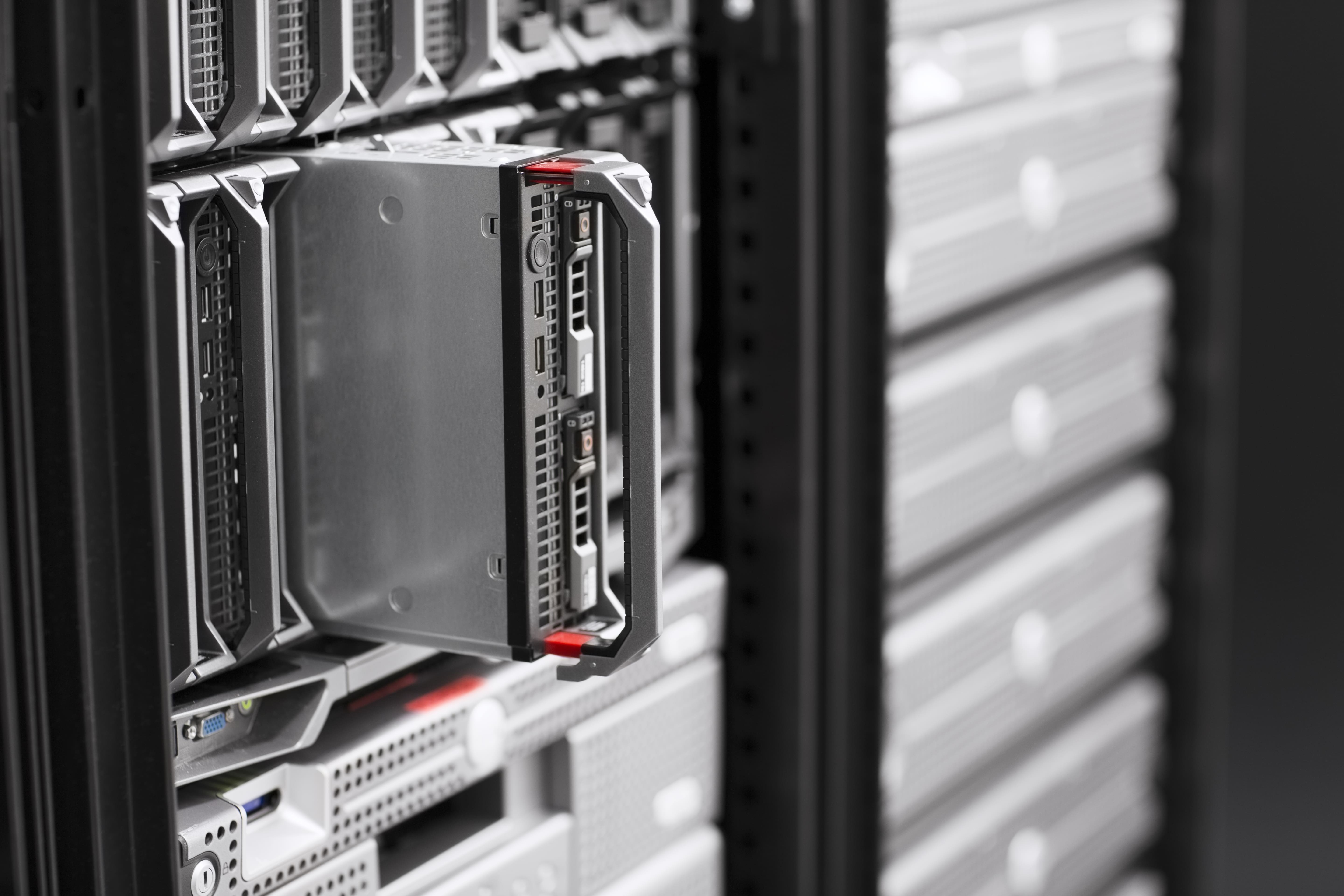 Pulling out a hard drive from data racks