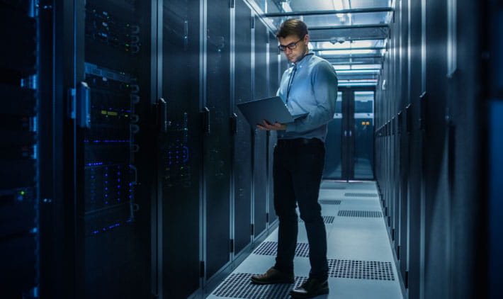 An IT engineer doing routine maintenance check and diagnosis